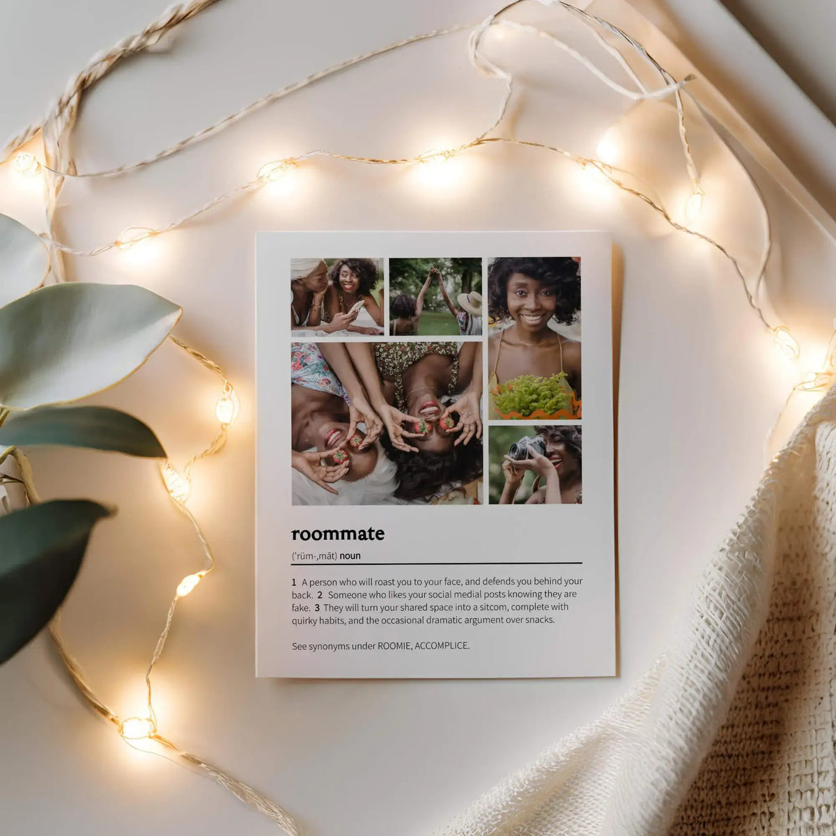Printed roommate photo collage next to string lights