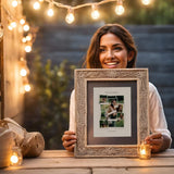Woman Holding Framed Roommate Photo Collage Outside Under String Lights