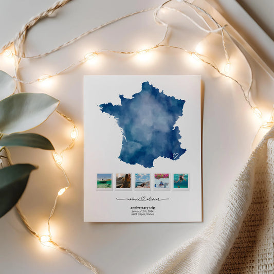 Print of Blue Map of France in on flatlay with string lights