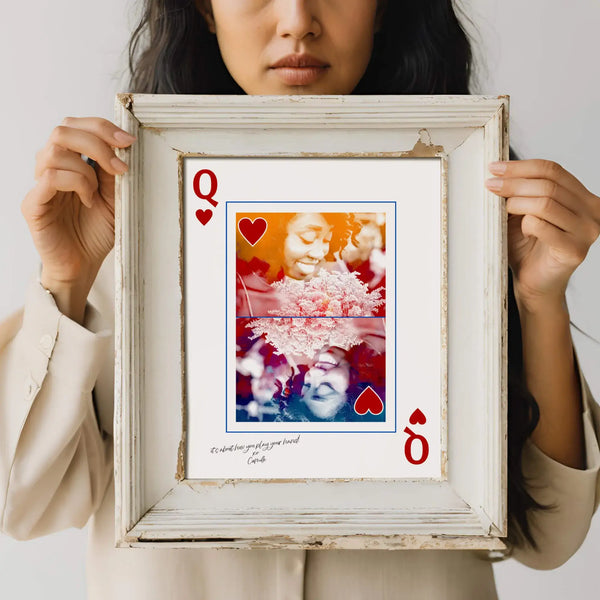 Woman holding queen of hearts card portrait in distressed cream coloured frame