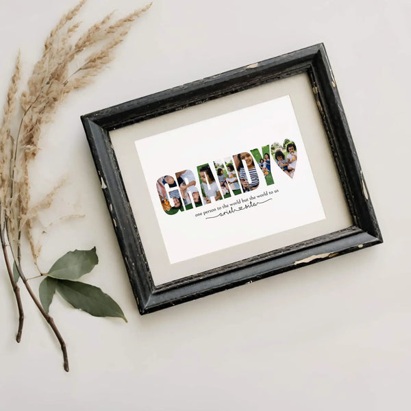 Grandy photo collage in black frame lying next to dried pampas grass.