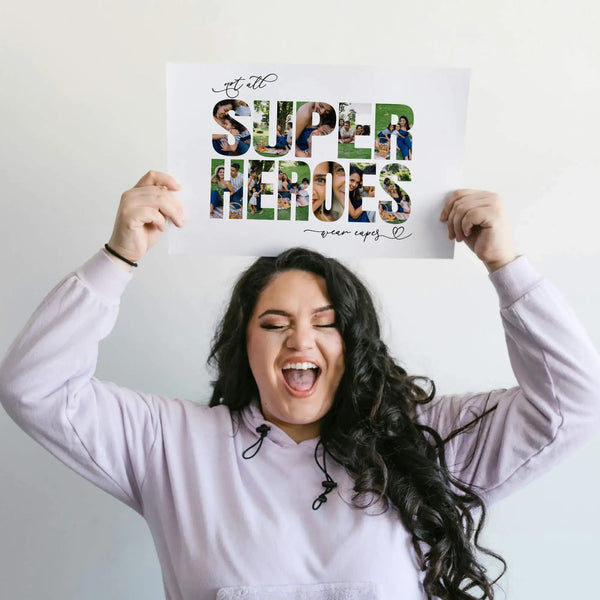 Woman with long dark hair holding Super Heroes Photo Collage print above her head