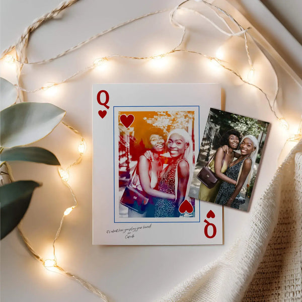 Queen of hearts portrait with a photo sitting on top surrounded by string lights