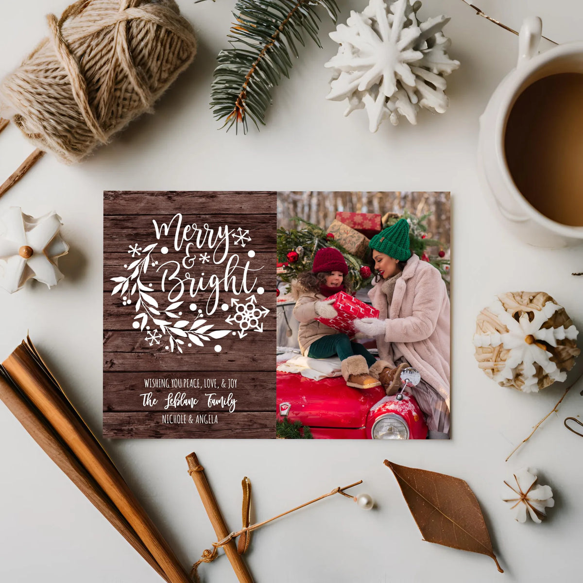 Woman Holding Christmas Photo Card with String lights in background