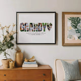 Grandy photo collage in black frame hanging on wall above mid century wood bureau in living room.