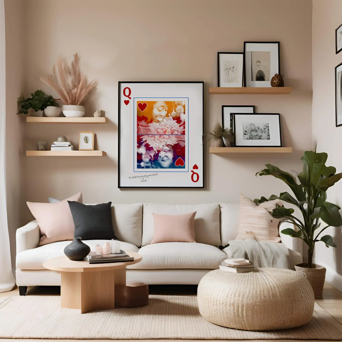 Queen of Hearts portrait in sleek black frame hanging above chic ivory couch in feminine style living room