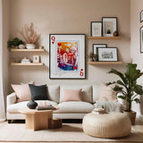 Queen of hearts portrait in sleek black frame hanging above chic ivory coloured sofa in feminine style living room