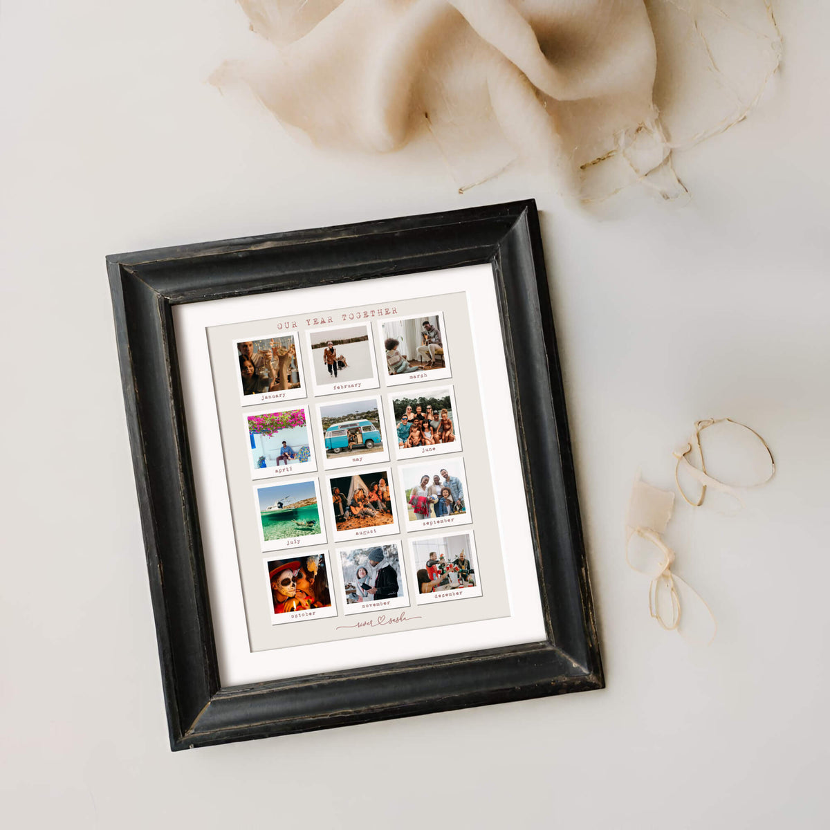 Framed 'our year together' photo collage on flatlay wih strands of fabric