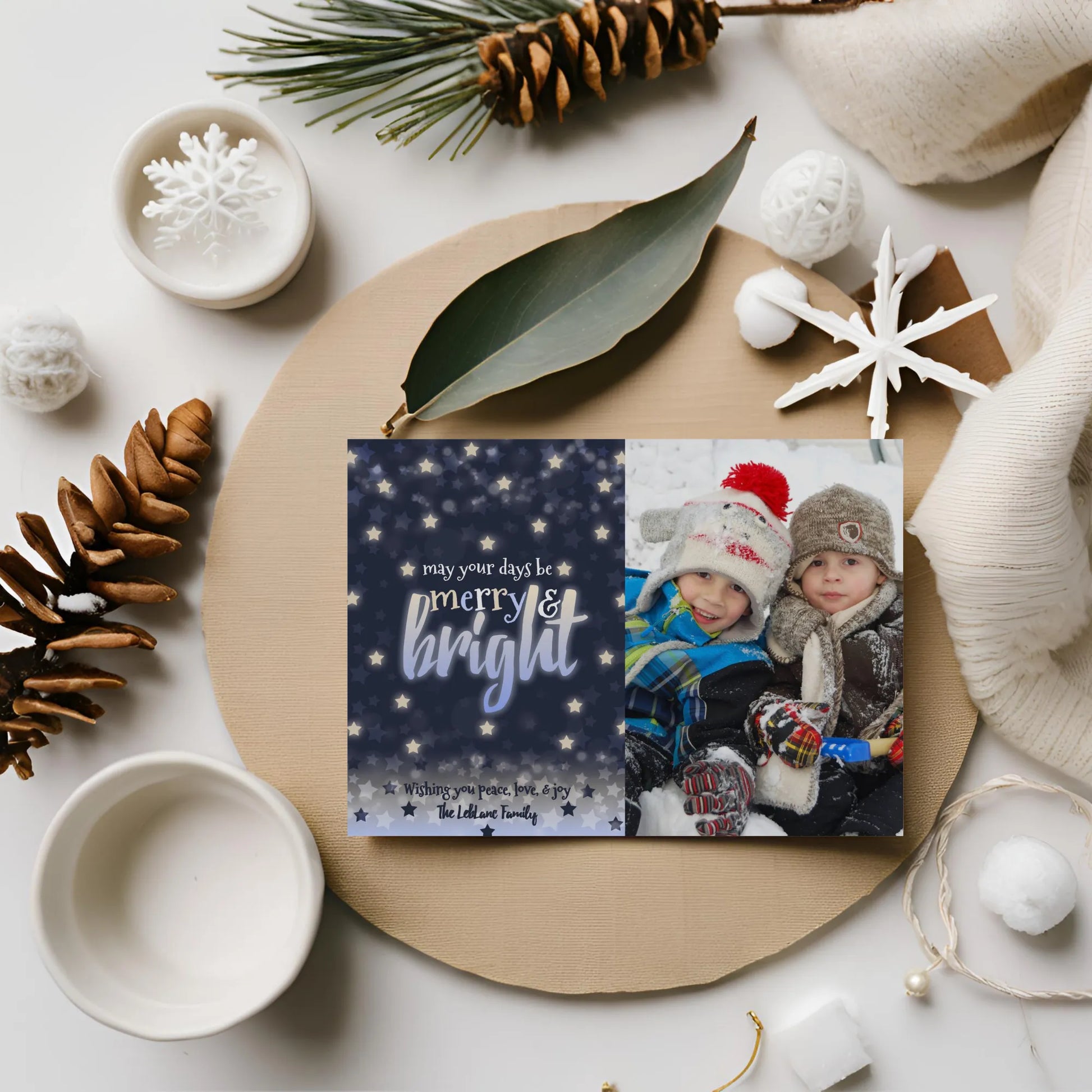 Navy holiday photo card on flat lay with winter props