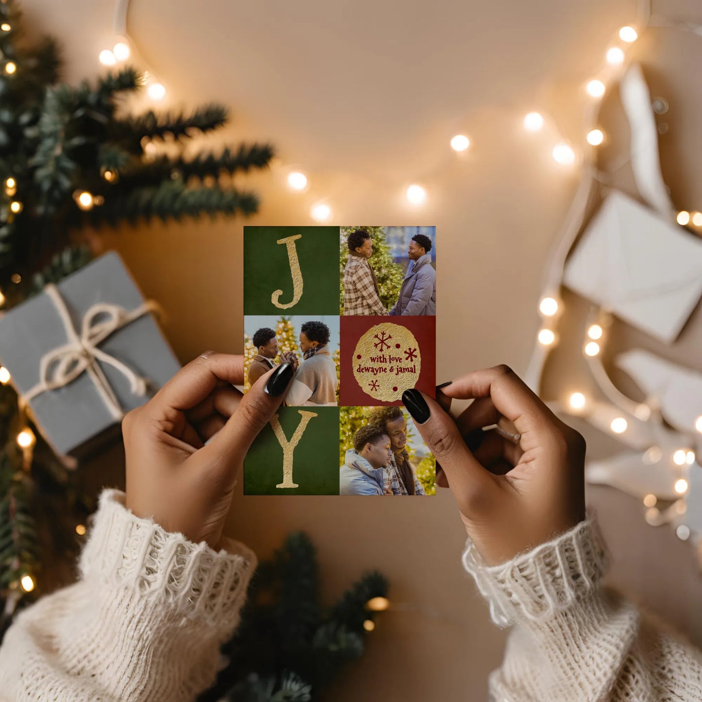 Woman holding Christmas photo card with string lights in background