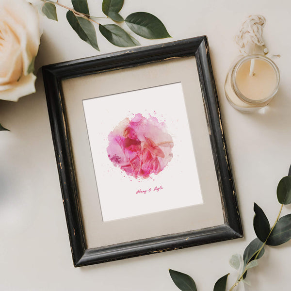 Framed pink watercolour portrait next to branch