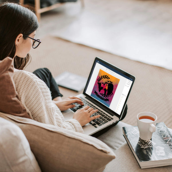 Woman editing pop art portrait template on laptop