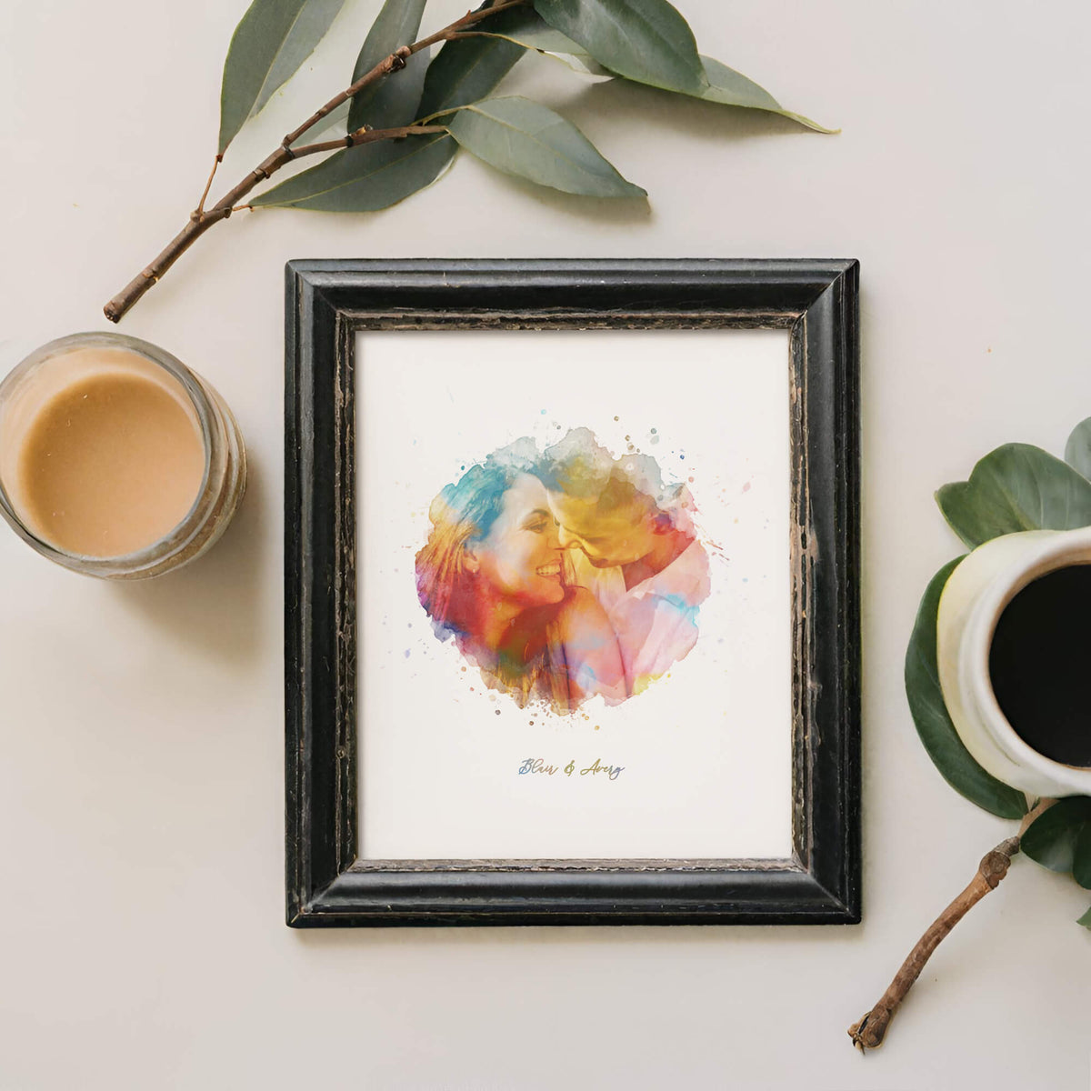 Framed rainbow watercolour portrait next to branch