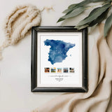 Spanish Keepsake Map Art in distressed black frame lying next to beige linen and a branch with leaves